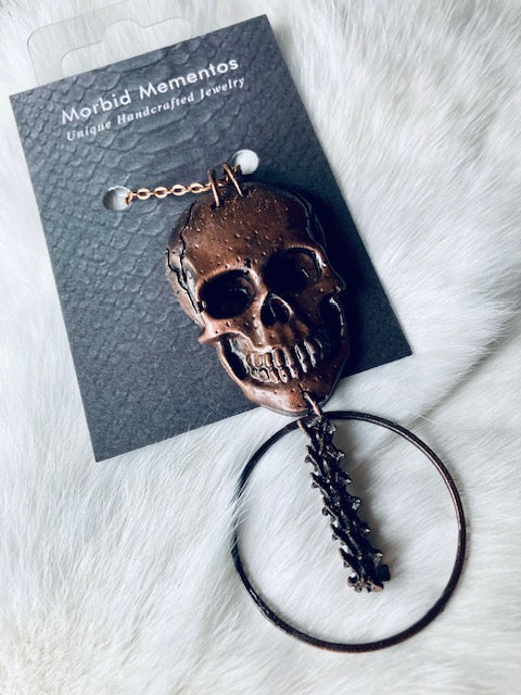 Copper Skull and Rattlesnake Spine Necklace