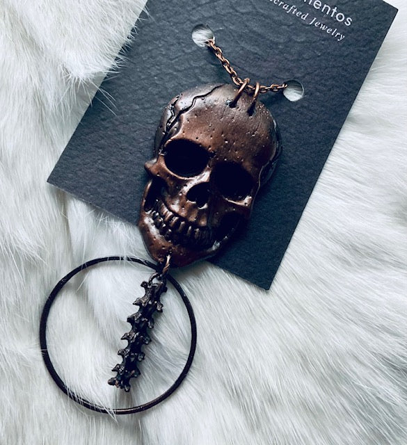 Copper Skull and Rattlesnake Spine Necklace
