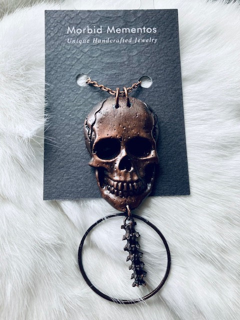 Copper Skull and Rattlesnake Spine Necklace
